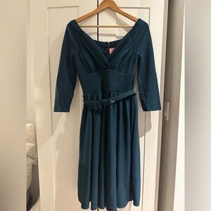 Starlet Swing Dress in Hunter Green by designer Micheline Pitt. Brand: Vixen